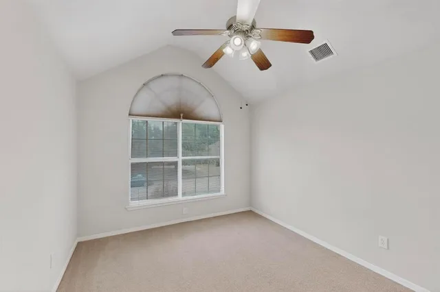 a view of a livingroom with a ceiling fan