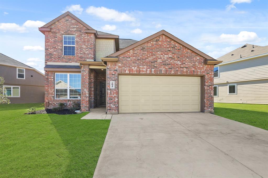 5025 Wellborn Road Crowley, TX 76036 - Photo 1 of 38 a front view of a house with a garden and yard