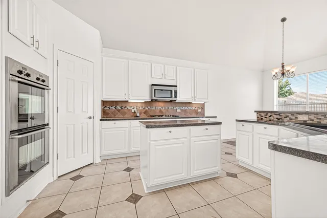 a bathroom with a sink double vanity and a mirror
