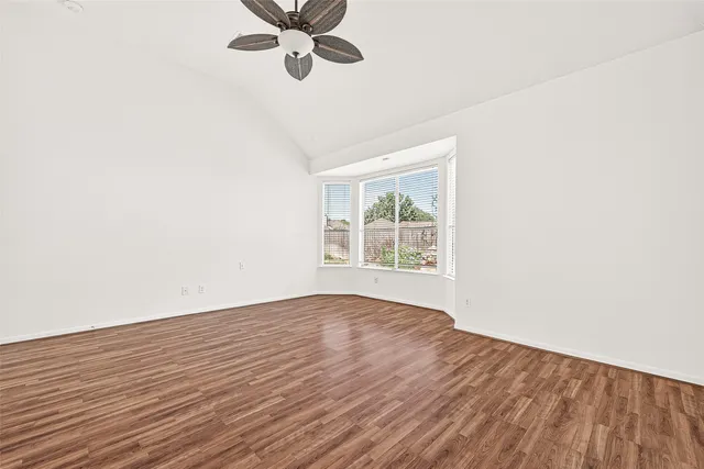a view of a swimming pool with an outdoor seating and a potted plant