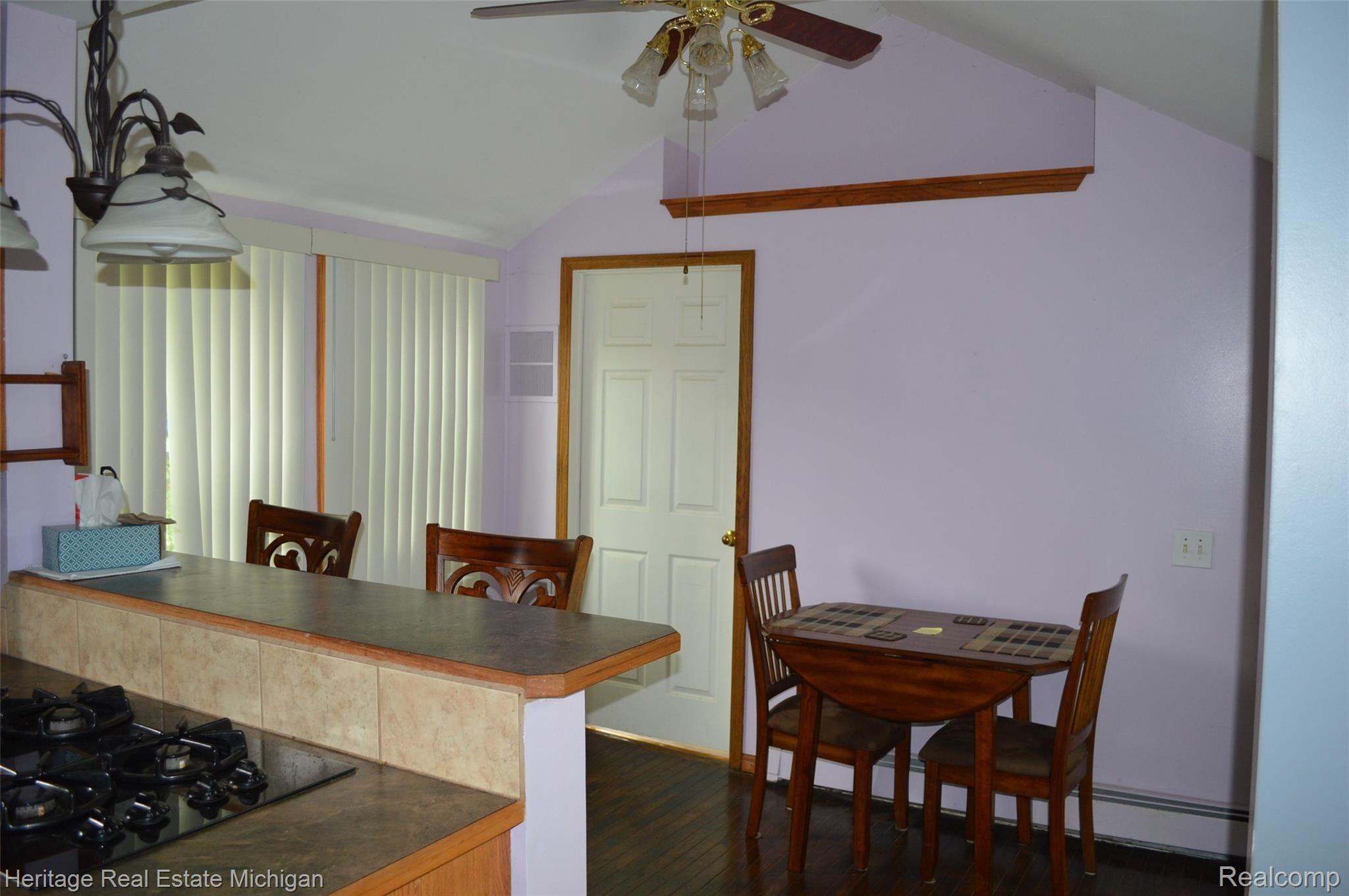 9423 Roland Brighton, MI 48116 - Photo 15 of 23 Dining area. Door leads to laundry