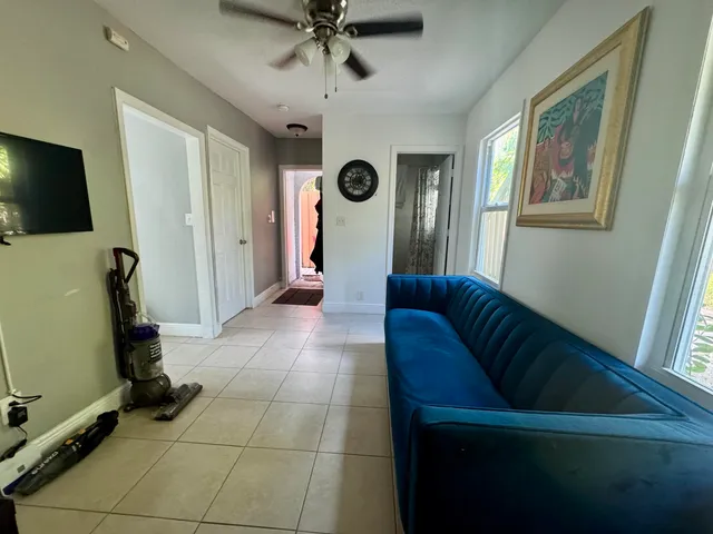 a living room with a couch and a flat screen tv