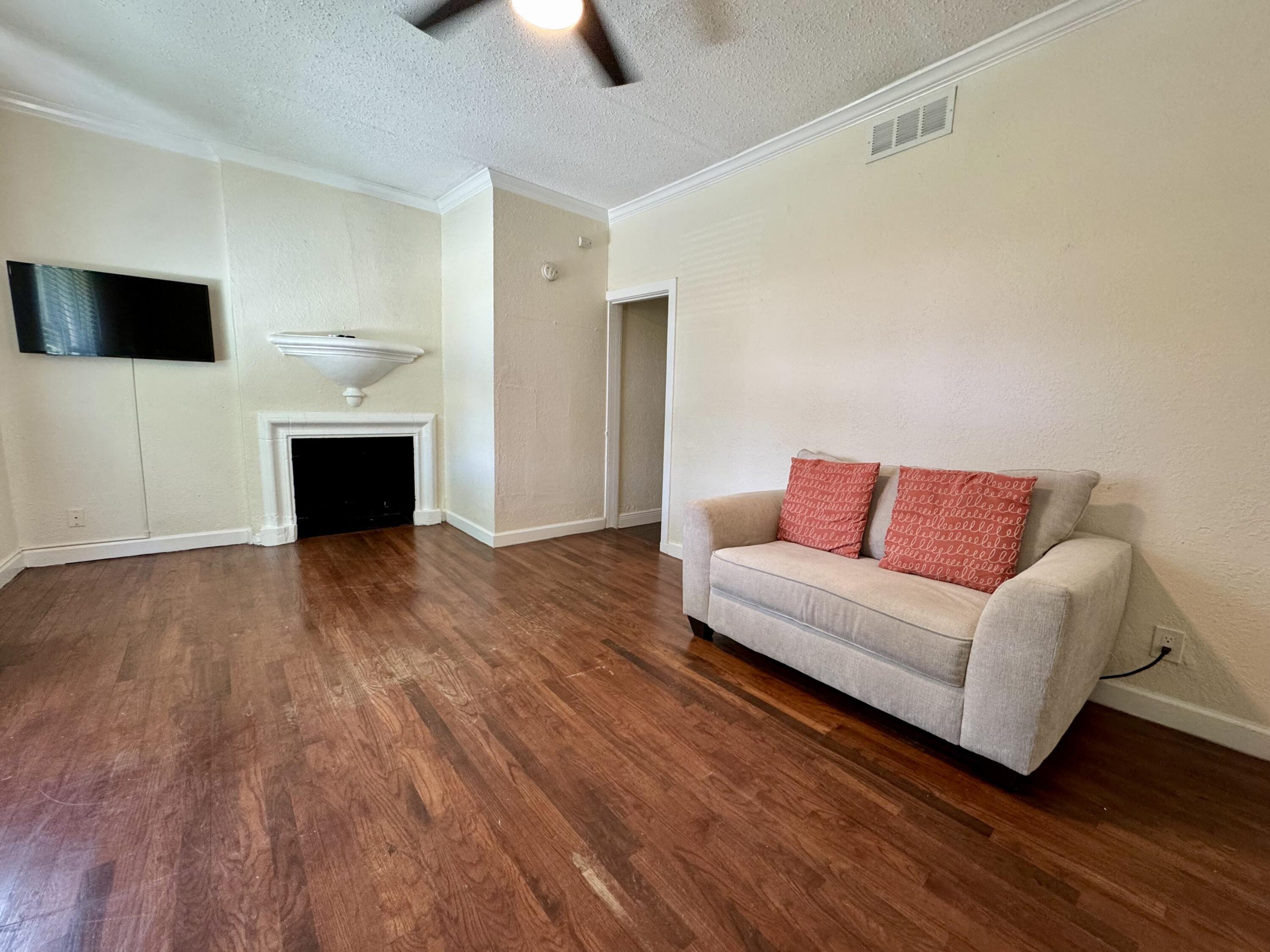 415 31st Street, Unit 16 West Palm Beach, FL 33407 - Photo 4 of 49 #1 Living Room w/ Fireplace