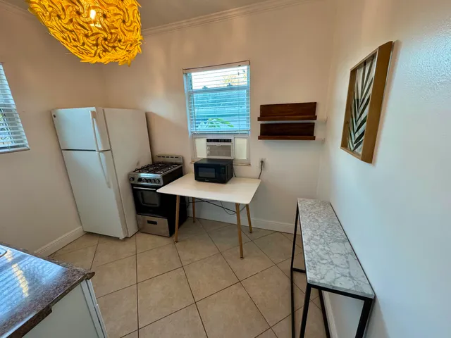 a view of workspace with furniture and a window