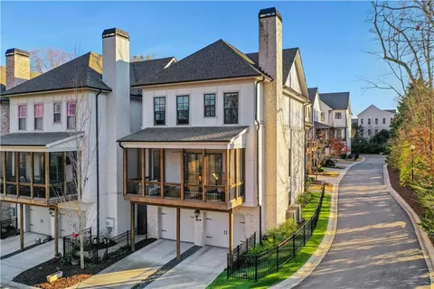 a front view of house with yard outdoor seating and barbeque oven