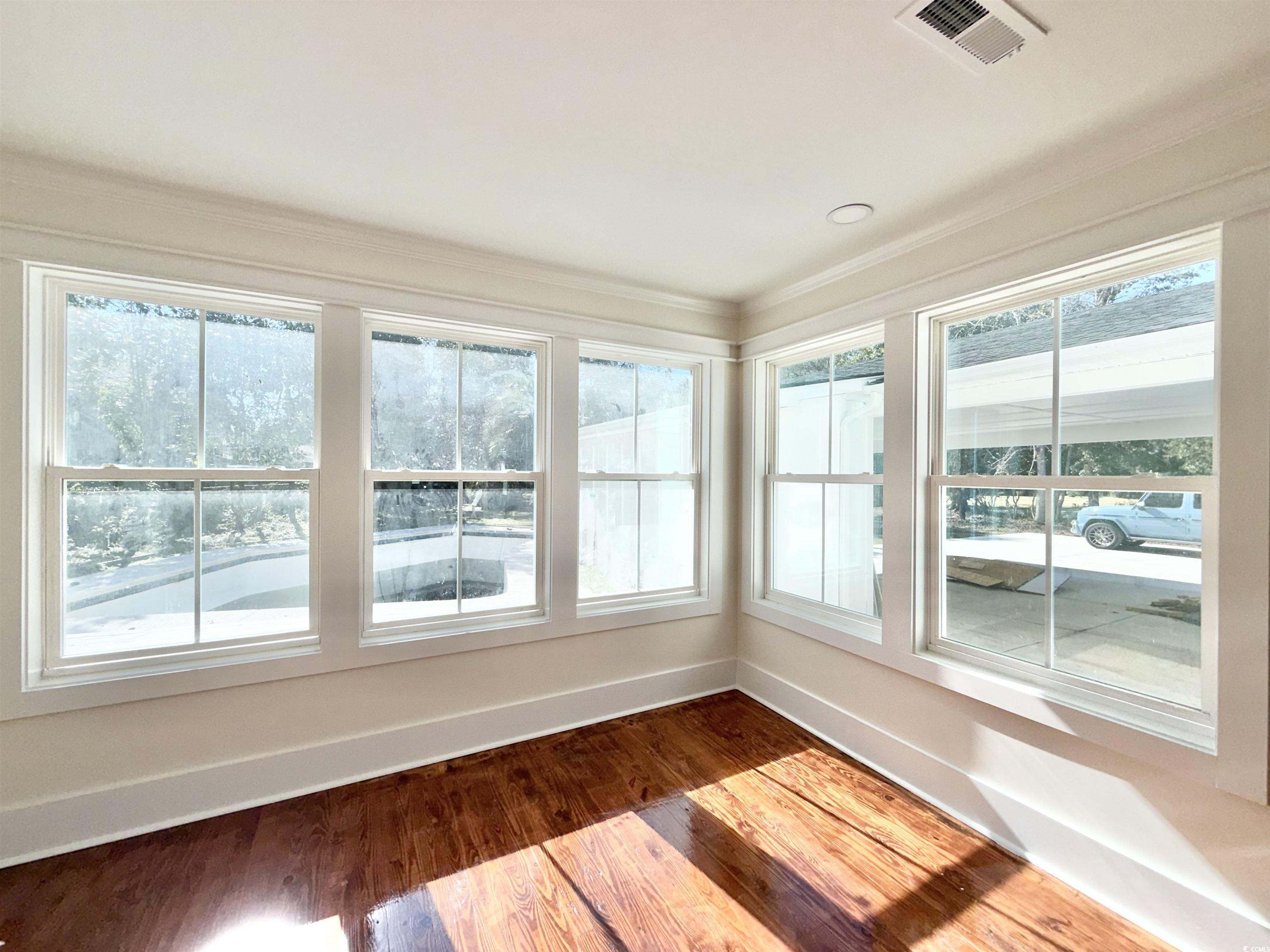 1003 Winding Road Conway, SC 29526 - Photo 13 of 32 Unfurnished sunroom featuring wood finished floors and ornamental molding