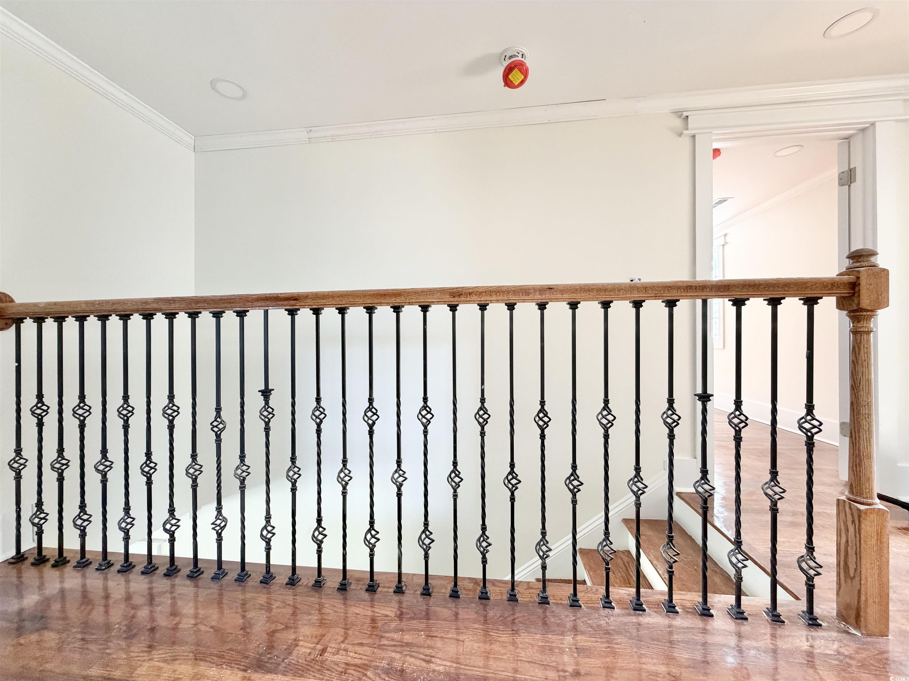 1003 Winding Road Conway, SC 29526 - Photo 16 of 32 Stairs with crown molding and wood finished floors