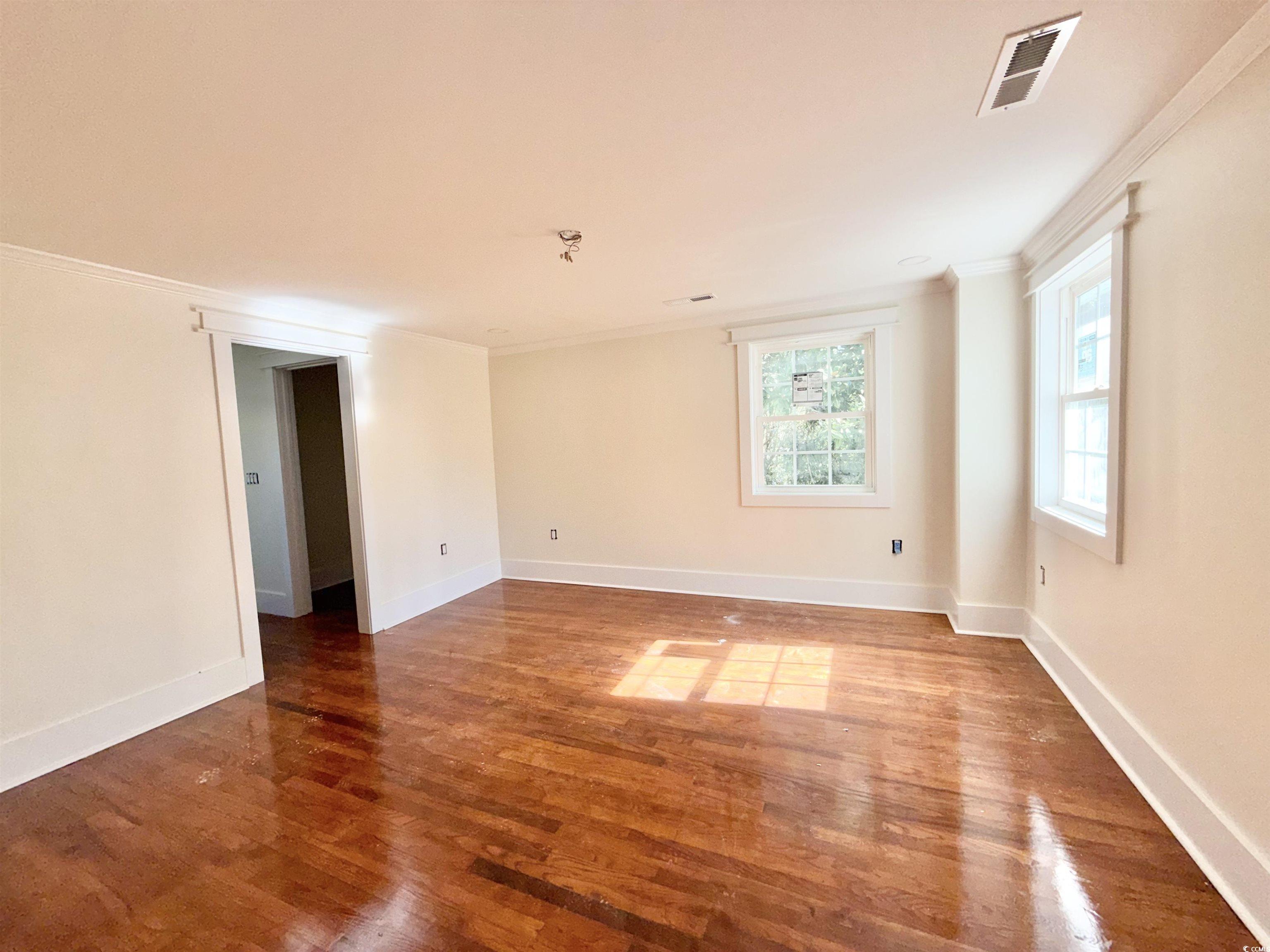 1003 Winding Road Conway, SC 29526 - Photo 18 of 32 Spare room with ornamental molding and wood finished floors