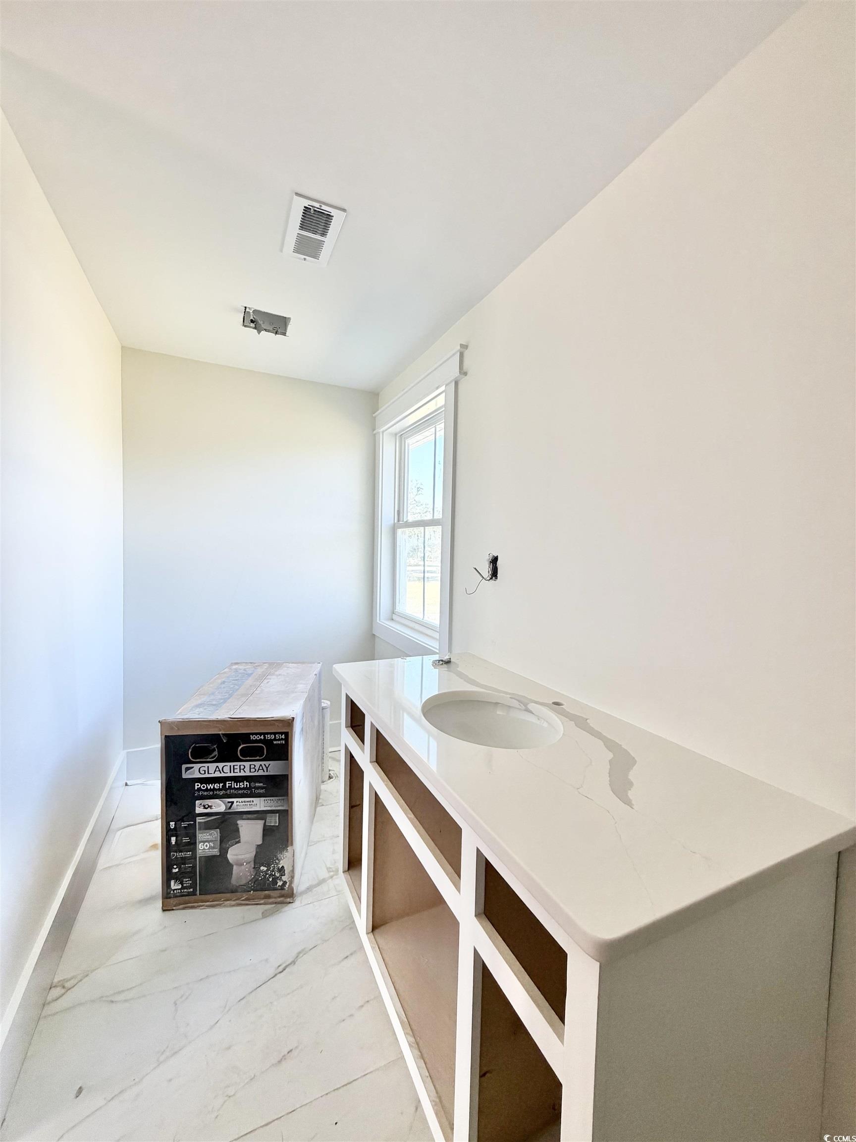 1003 Winding Road Conway, SC 29526 - Photo 20 of 32 Bathroom with vanity and light marble finish flooring