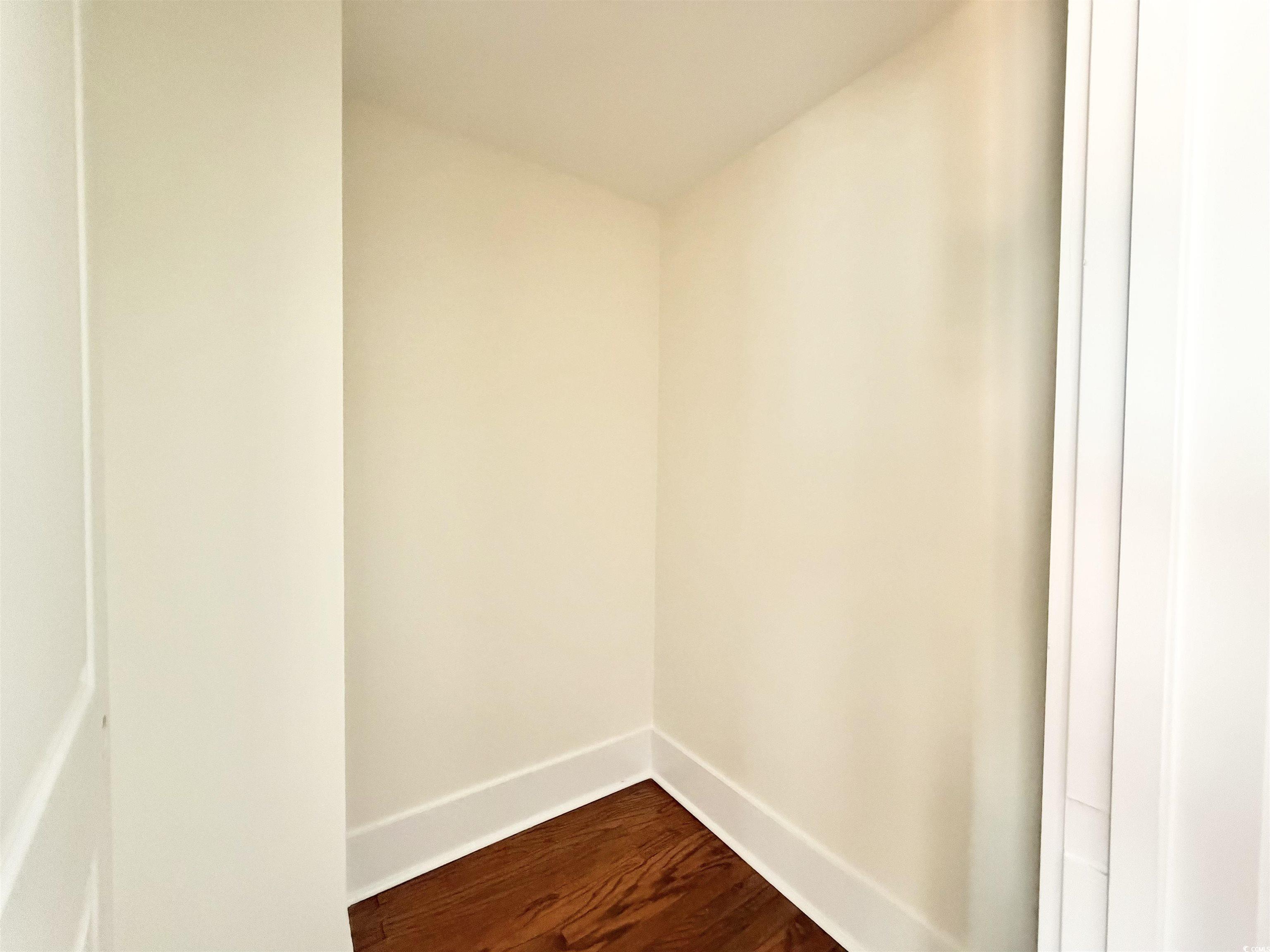 1003 Winding Road Conway, SC 29526 - Photo 22 of 32 Spare room with dark wood finished floors and baseboards