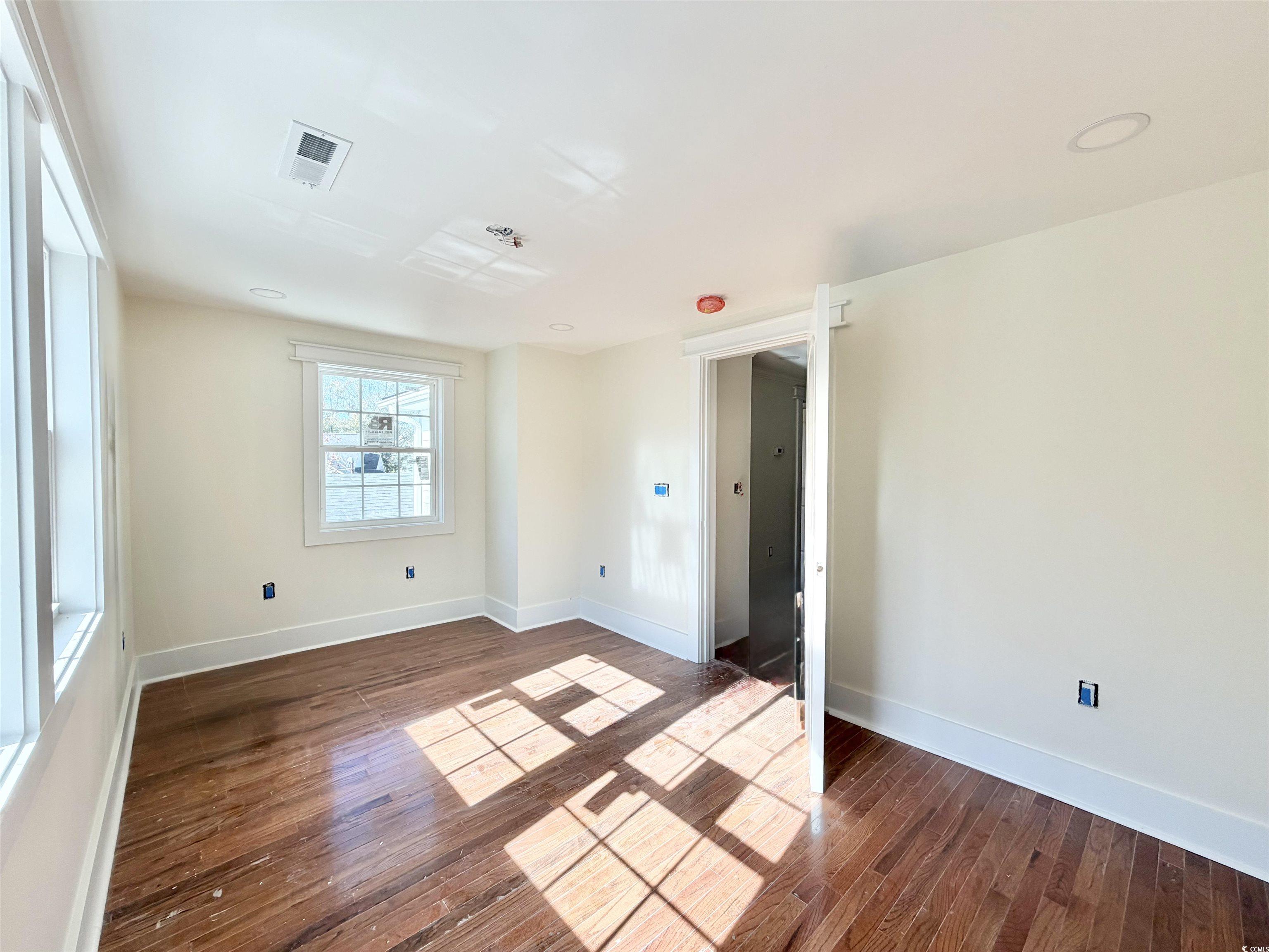 1003 Winding Road Conway, SC 29526 - Photo 25 of 32 Unfurnished room featuring dark wood-type flooring