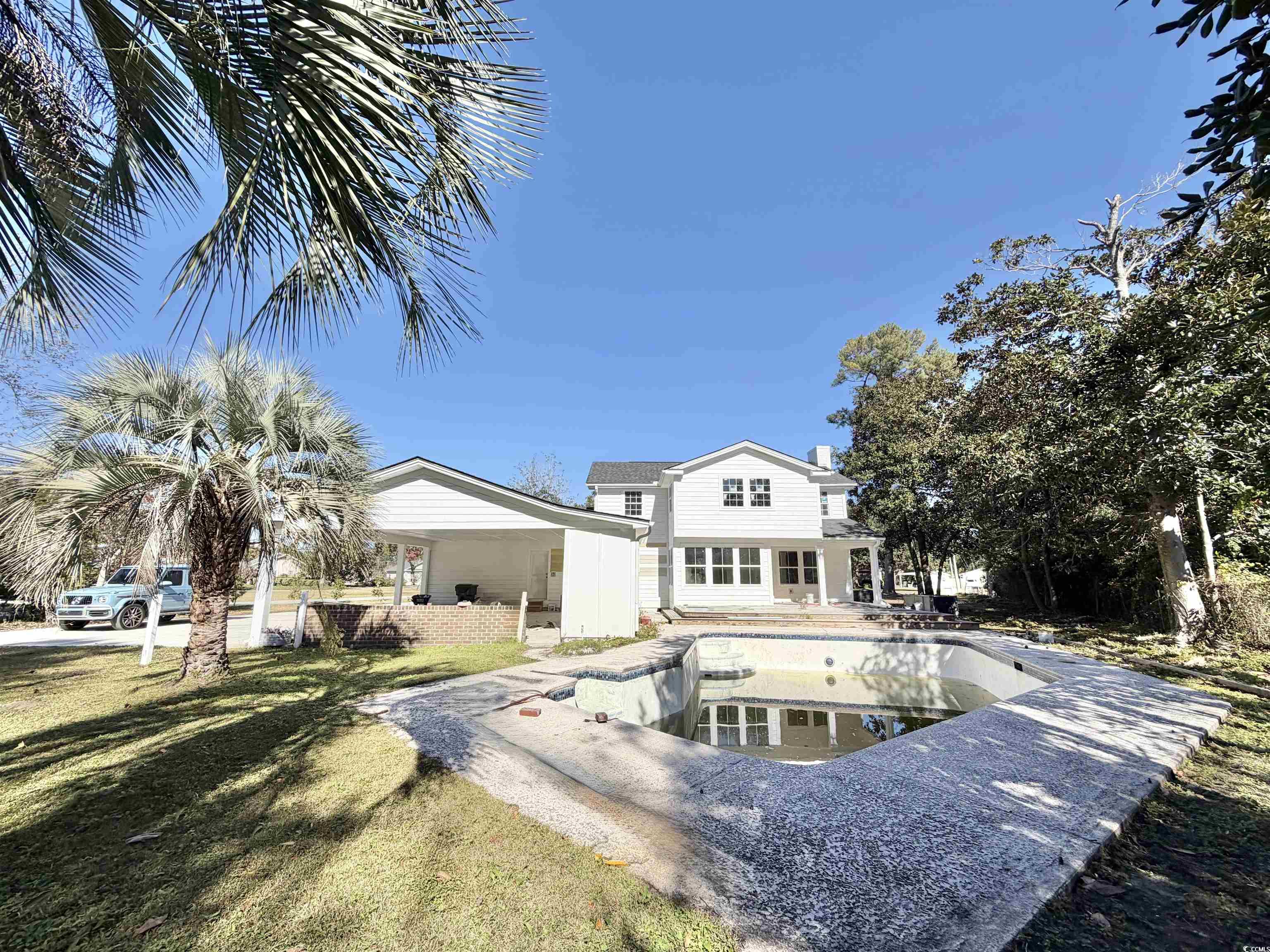1003 Winding Road Conway, SC 29526 - Photo 30 of 32 Back of house with a patio and an empty pool
