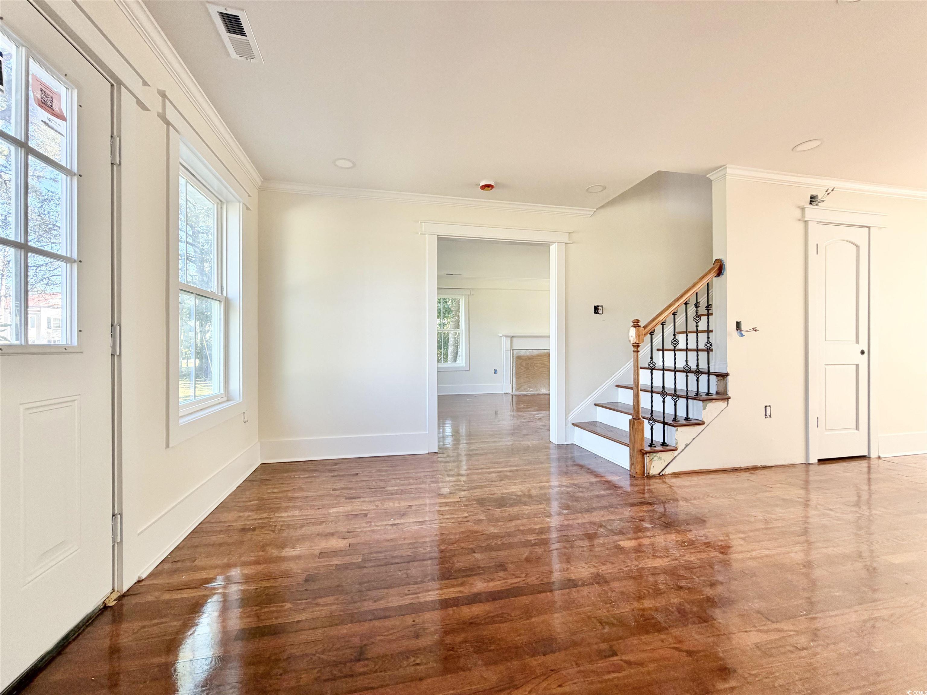 1003 Winding Road Conway, SC 29526 - Photo 3 of 32 Entrance foyer with ornamental molding, stairway, wood finished floors, and recessed lighting