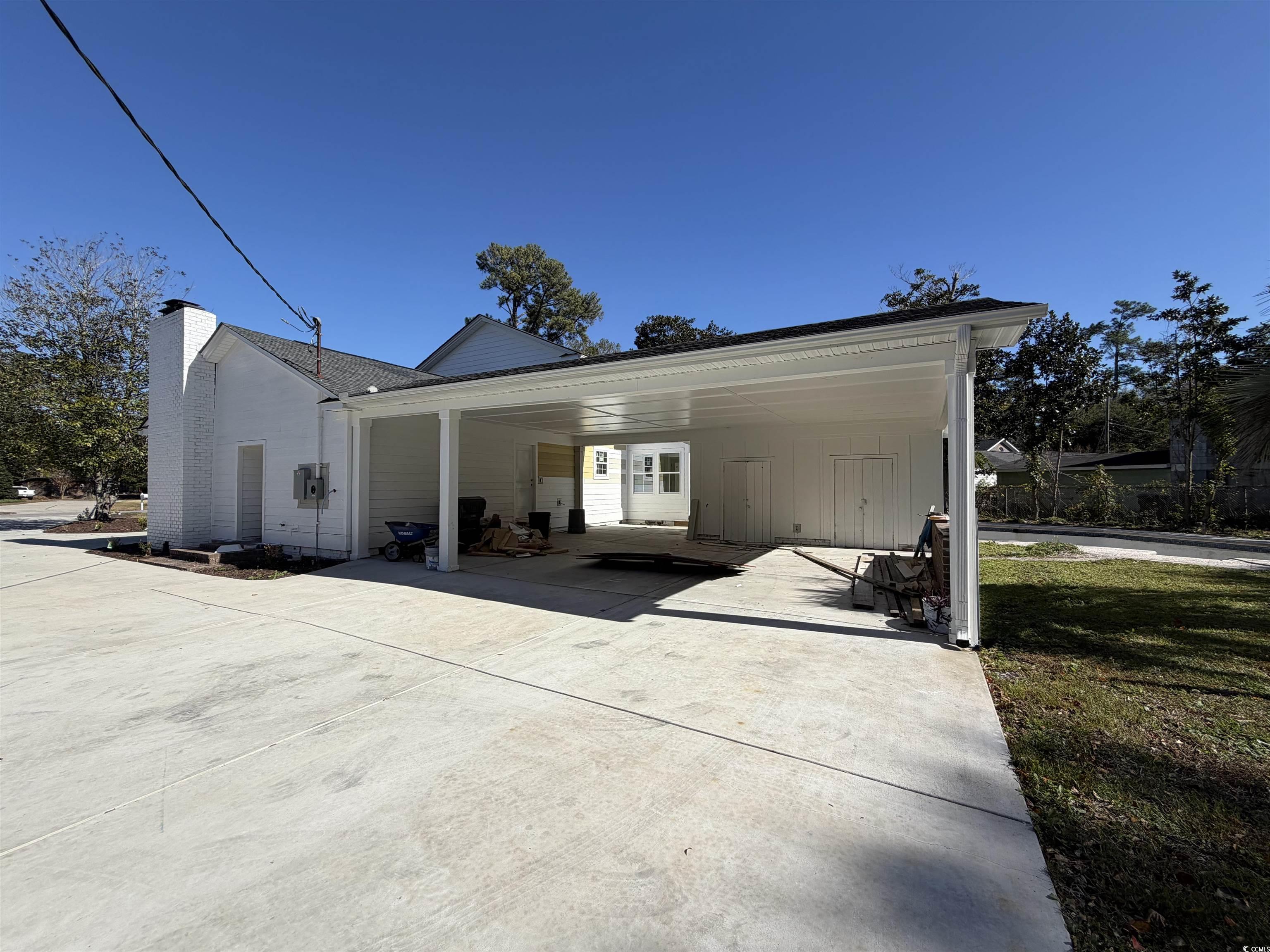 1003 Winding Road Conway, SC 29526 - Photo 32 of 32 View of property exterior featuring a chimney
