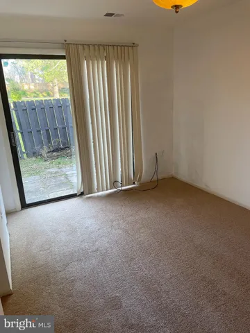 a view of a room with a window