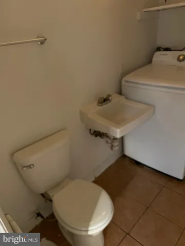 a bathroom with a toilet and a sink