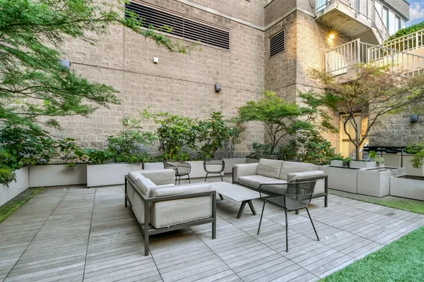 a view of a terrace with furniture
