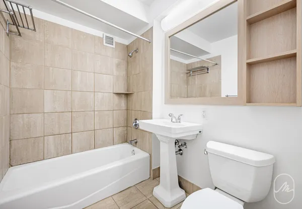a bathroom with a sink toilet and bathtub