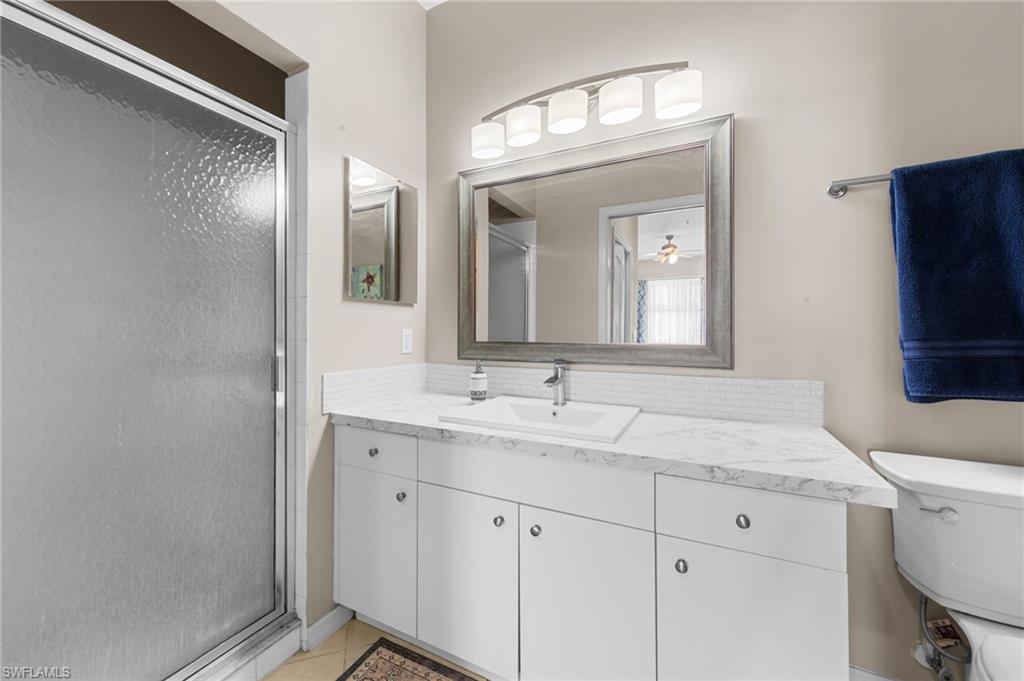 8570 Kingbird Loop, Unit 547 Estero, FL 33967 - Photo 17 of 50 a bathroom with a sink and a mirror