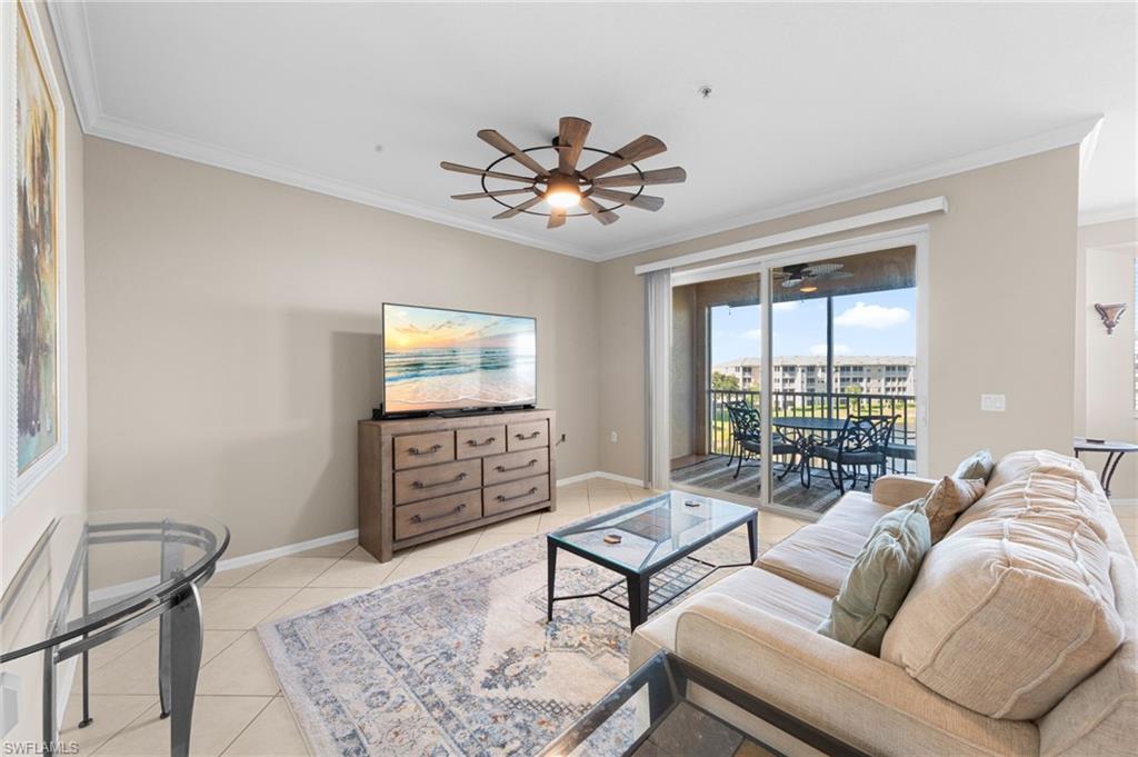 8570 Kingbird Loop, Unit 547 Estero, FL 33967 - Photo 2 of 50 a living room with furniture and a ceiling fan