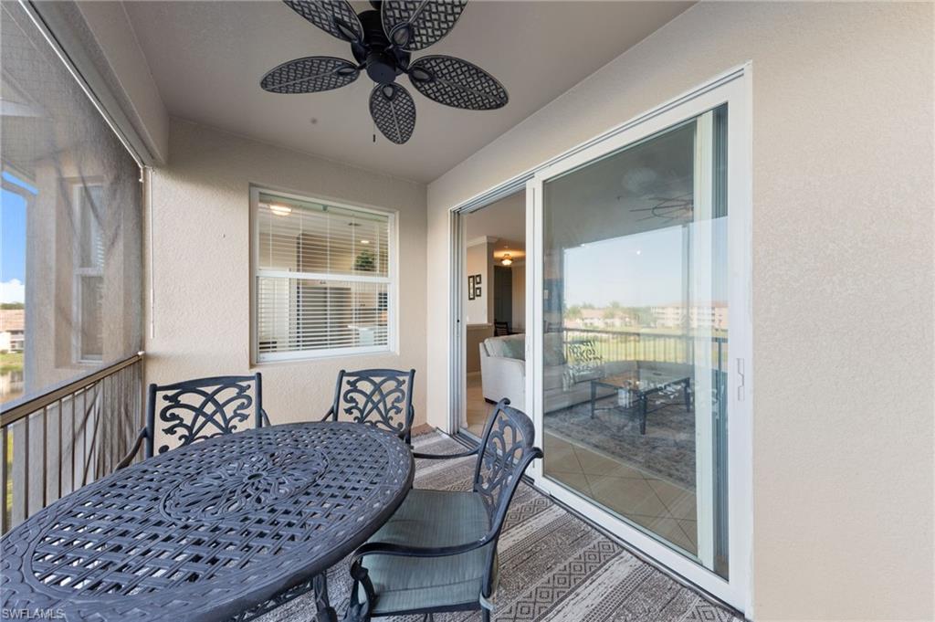 8570 Kingbird Loop, Unit 547 Estero, FL 33967 - Photo 24 of 50 a view of a dining room with furniture window and wooden floor