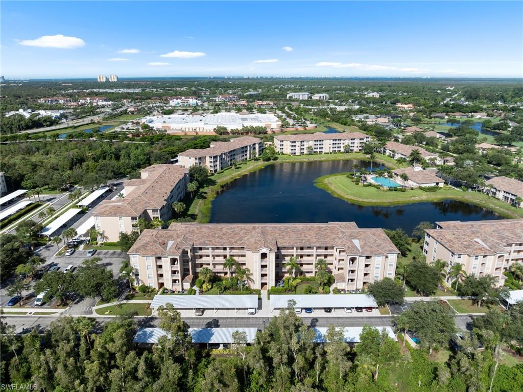 8570 Kingbird Loop, Unit 547 Estero, FL 33967 - Photo 29 of 50 an aerial view of a city with lots of residential buildings ocean and mountain view in back