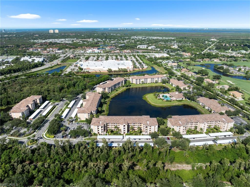 8570 Kingbird Loop, Unit 547 Estero, FL 33967 - Photo 30 of 50 an aerial view of residential houses with outdoor space and trees