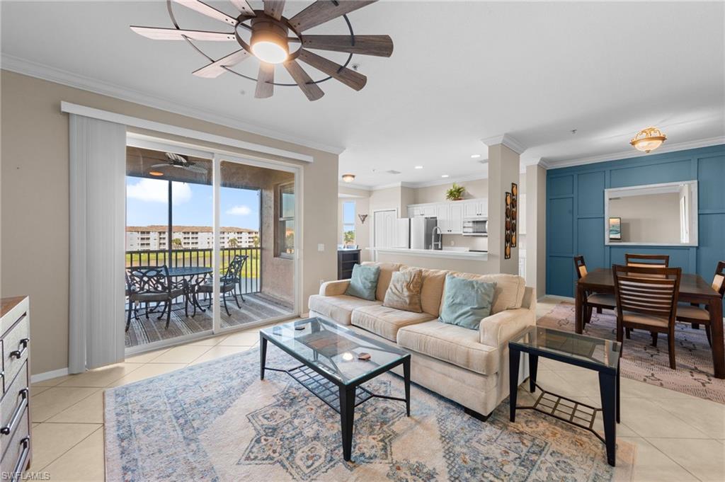 8570 Kingbird Loop, Unit 547 Estero, FL 33967 - Photo 3 of 50 a living room with furniture a table and a large window