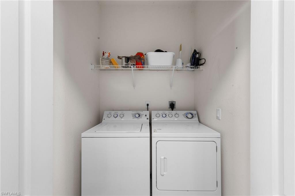 8570 Kingbird Loop, Unit 547 Estero, FL 33967 - Photo 31 of 50 a utility room with dryer and washer