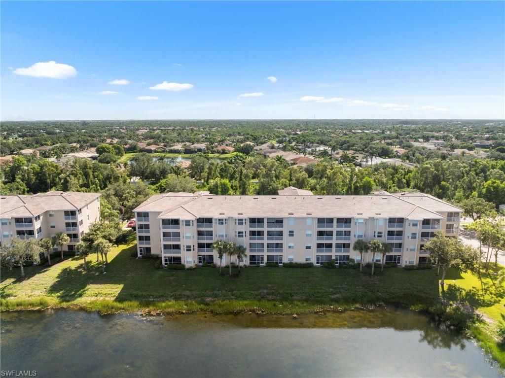 8570 Kingbird Loop, Unit 547 Estero, FL 33967 - Photo 32 of 50 an aerial view of a house with a garden