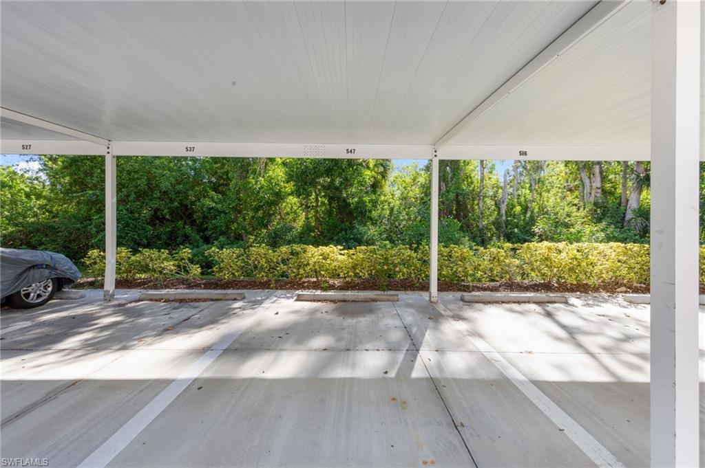 8570 Kingbird Loop, Unit 547 Estero, FL 33967 - Photo 37 of 50 a view of a car park from a ceiling window