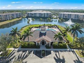 8570 Kingbird Loop, Unit 547 Estero, FL 33967 - Photo 38 of 50 a view of a lake with a city