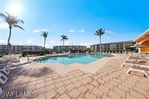 8570 Kingbird Loop, Unit 547 Estero, FL 33967 - Photo 42 of 50 a view of a lake with a yard