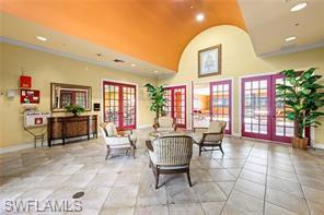 8570 Kingbird Loop, Unit 547 Estero, FL 33967 - Photo 44 of 50 a living room with furniture and large windows