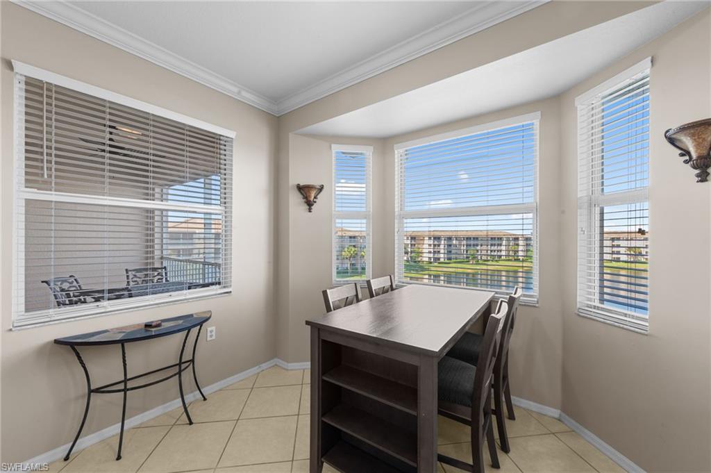 8570 Kingbird Loop, Unit 547 Estero, FL 33967 - Photo 7 of 50 a view of a dining room with furniture and windows