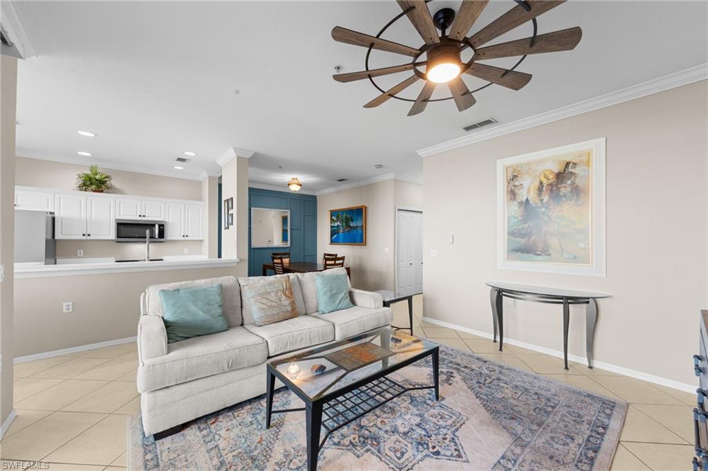 8570 Kingbird Loop, Unit 547 Estero, FL 33967 - Photo 10 of 50 a living room with furniture and a chandelier