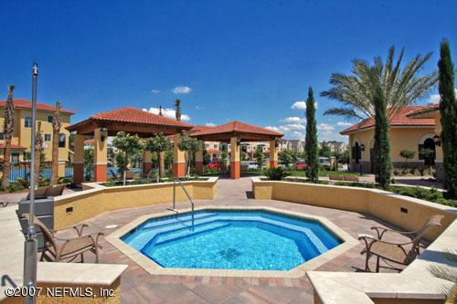 9745 Touchton Road, Unit 927 Jacksonville, FL 32246 - Photo 20 of 22 a view of a house with swimming pool and sitting area