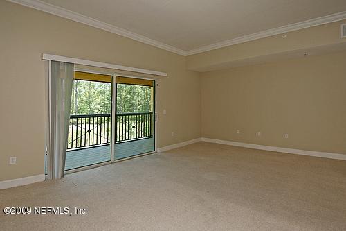 9745 Touchton Road, Unit 927 Jacksonville, FL 32246 - Photo 2 of 22 a view of an empty room with a balcony