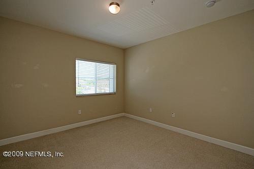 9745 Touchton Road, Unit 927 Jacksonville, FL 32246 - Photo 5 of 22 an empty room with a window