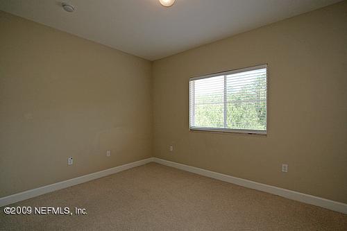 9745 Touchton Road, Unit 927 Jacksonville, FL 32246 - Photo 7 of 22 an empty room with a window