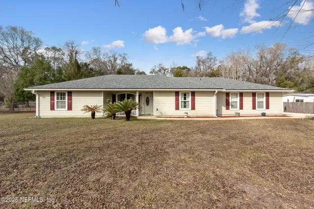 front view of a house with a yard