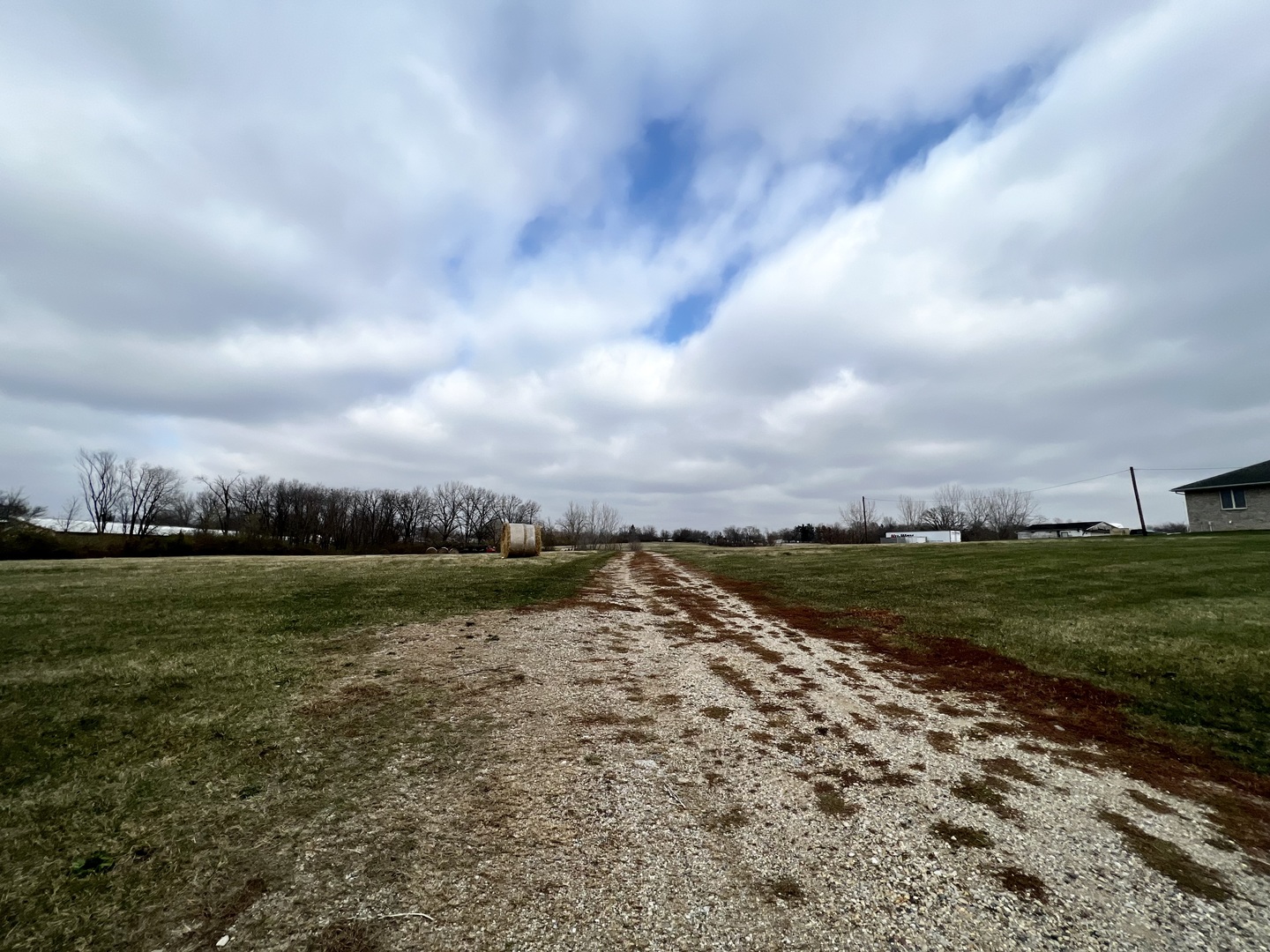 1723 6 Points Road Bloomington, IL 61701 - Photo 8 of 9 a view of a lake with a big yard