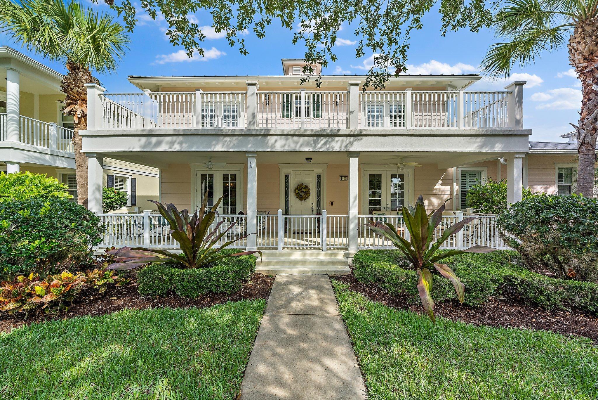 1421 Windley Key Way Jupiter, FL 33458 - Photo 1 of 53 a front view of a house with garden