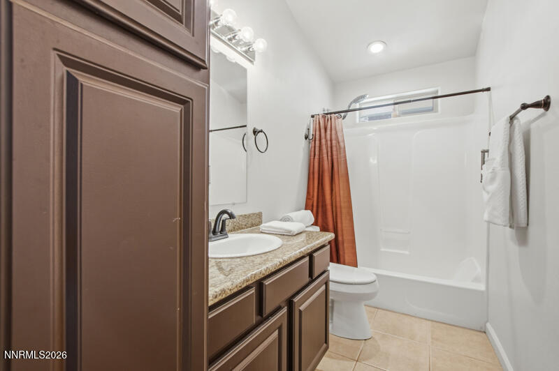 1367 Calavaras Road Reno, NV 89521 - Photo 14 of 26 a bathroom with a granite countertop sink toilet and shower