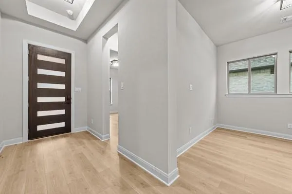 a view of an empty room with a window