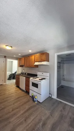 a kitchen with a stove and a microwave