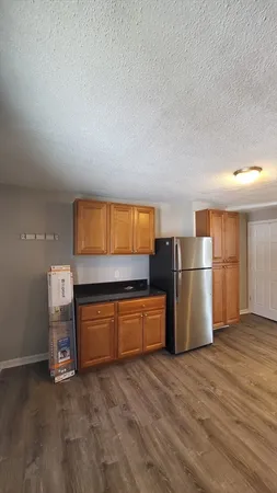 a room with furniture and wooden floor