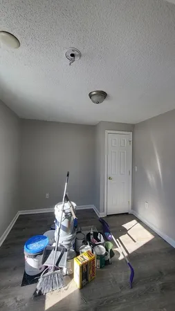 a room with furniture and wooden floor