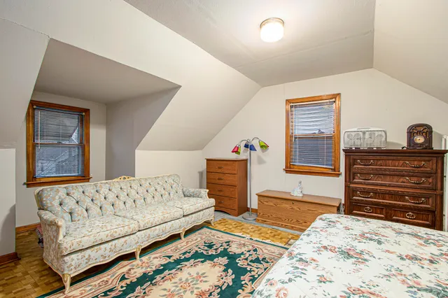 a bedroom with a bed and a dresser