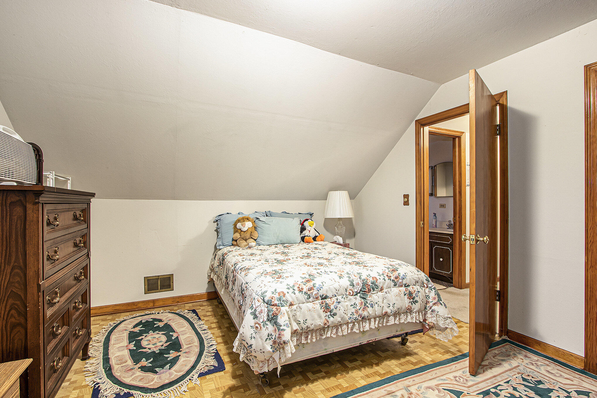 1027 Spruce Street Hammond, IN 46324 - Photo 12 of 17 a bedroom with a bed and a tv on the dresser